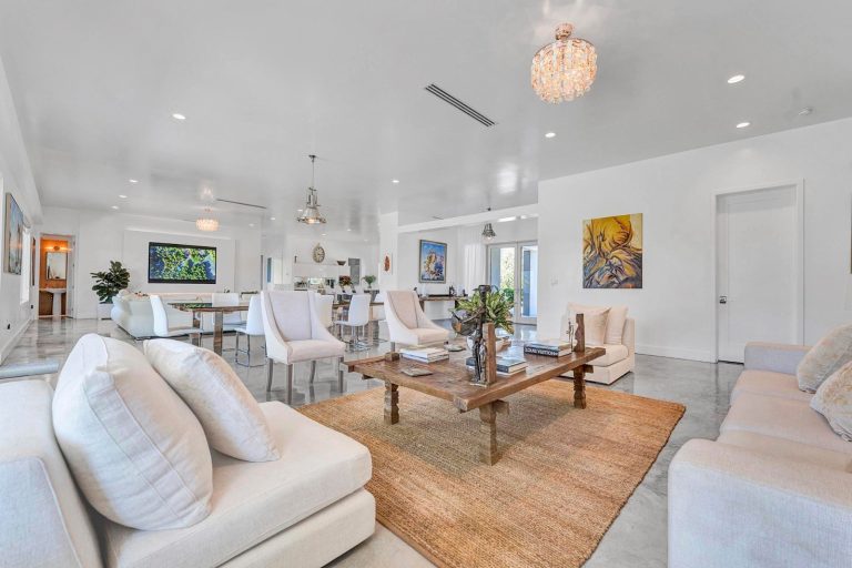 Comfortable living room seating arranged around a warm area rug