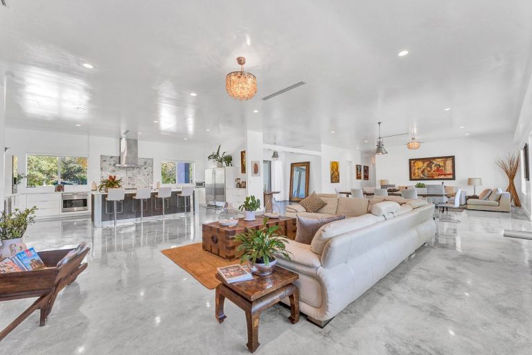 Expansive open living room with bright contemporary furnishings